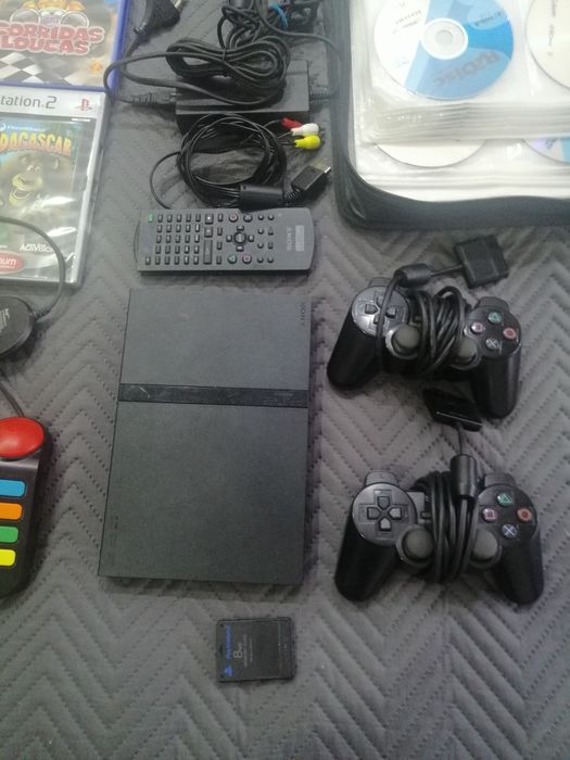 Playstation 2 com jogos campainhas e extras