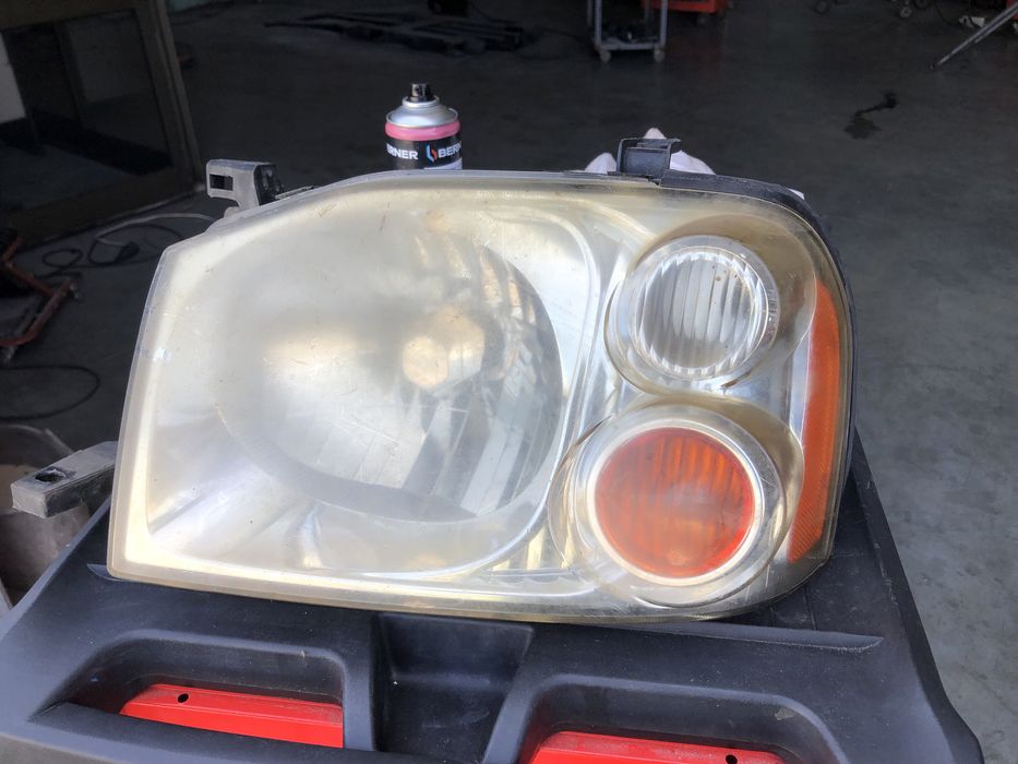 Farol  esquerdo nissan navara  original