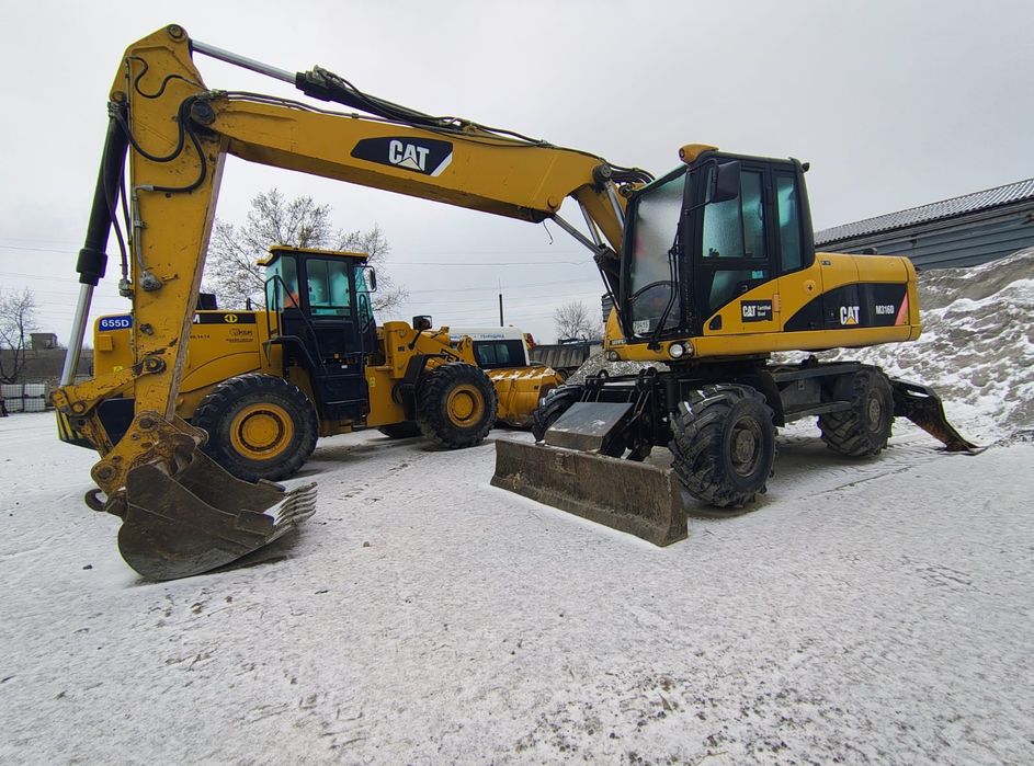 Продаж екскаватора Caterpillar CAT 316 колісний повноповоротний з ковш