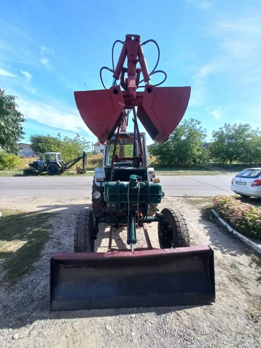 Грейферний погрузчик юмз