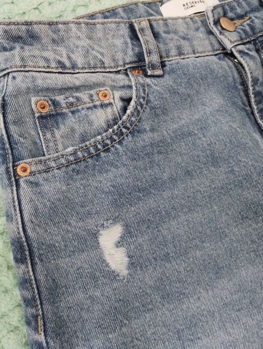 Spodnie jeansowe niebieski z przetarciami efekt sprania długie szeroke
