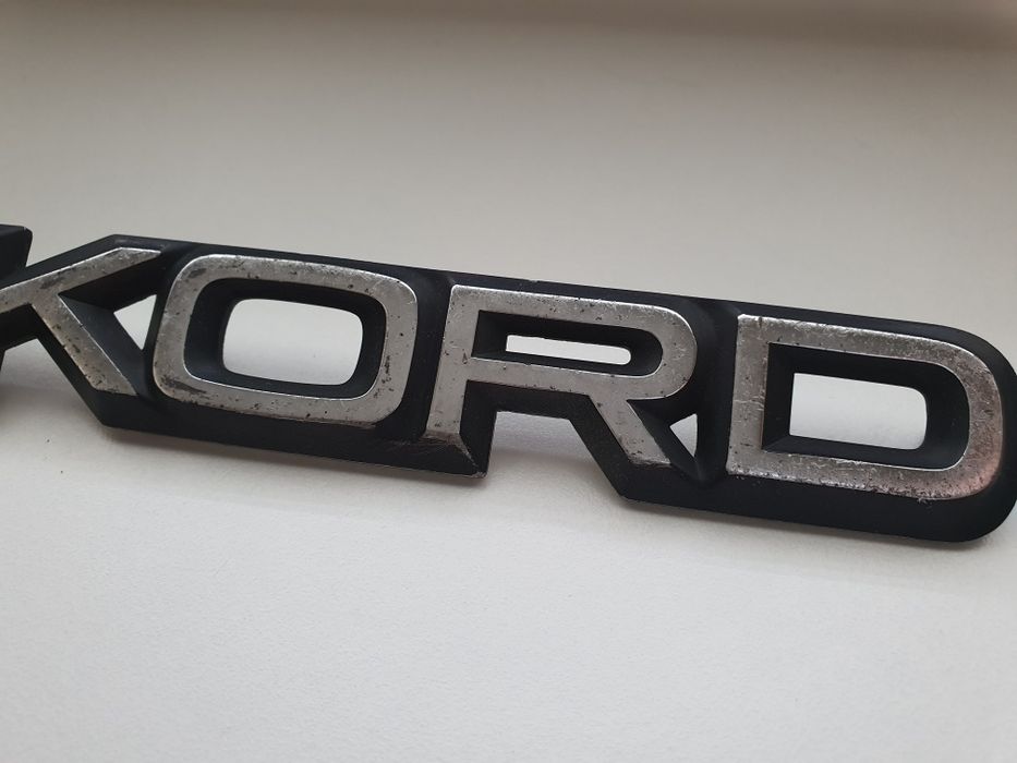 Opel Rekord emblemat napis