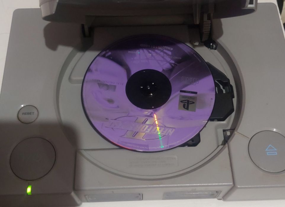 Ps1 fat com vários jogos 2 comandos originais e cartão de memória.