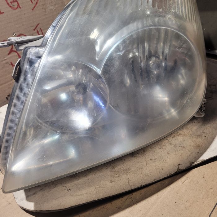Lampa przód lewa Toyota Corolla Verso I E12 2003r oryginał