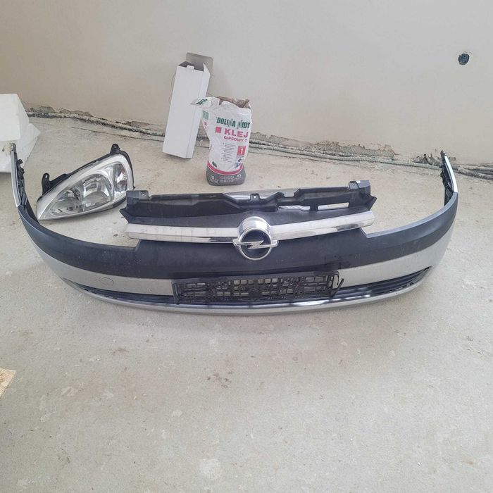 OPEL CORSA C - zderzak przedni, lampa lewa