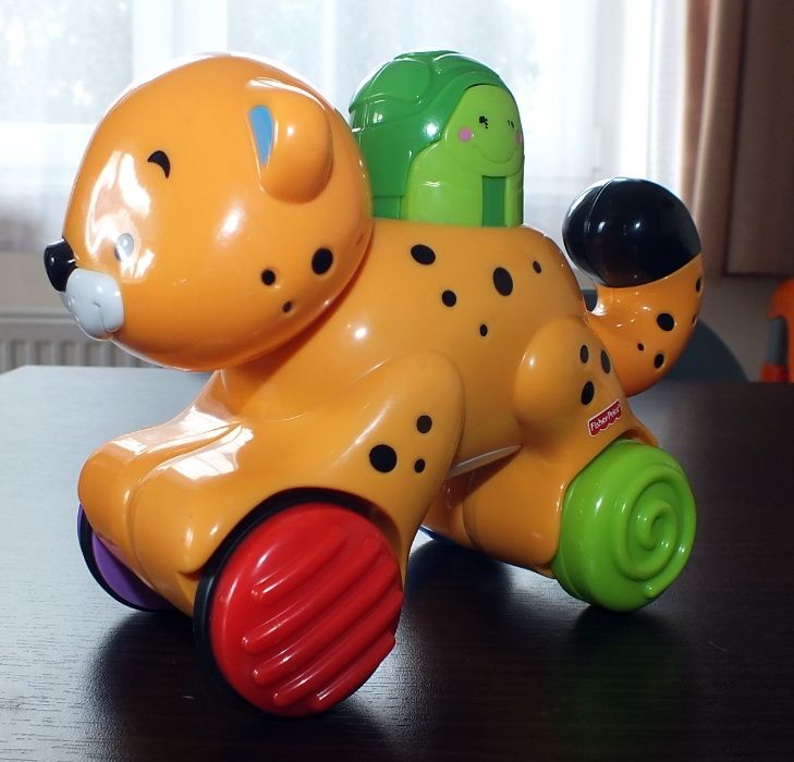 Fisher Price gerpard na kółkach