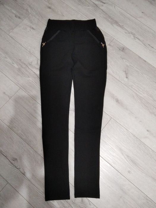 Nowe materiałowe spodnie rozm s