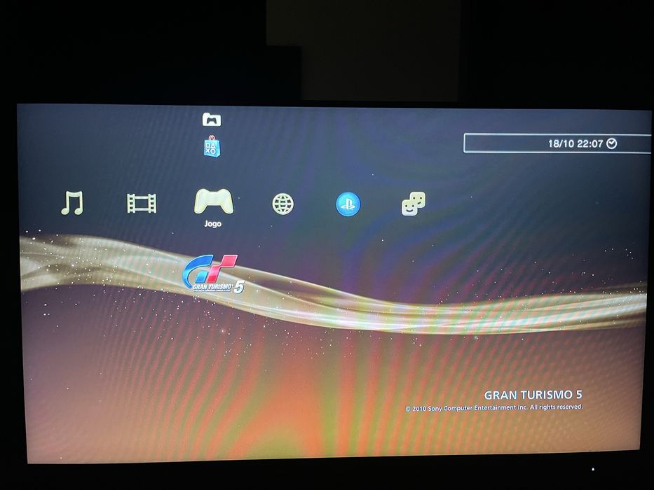 PS3 Slim com 2 jogos