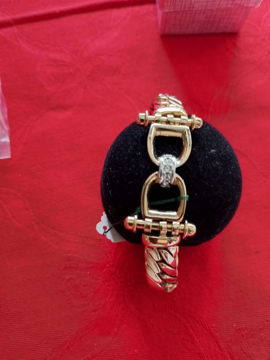 Pulseira  dourada com brilhantes  marca Shock
