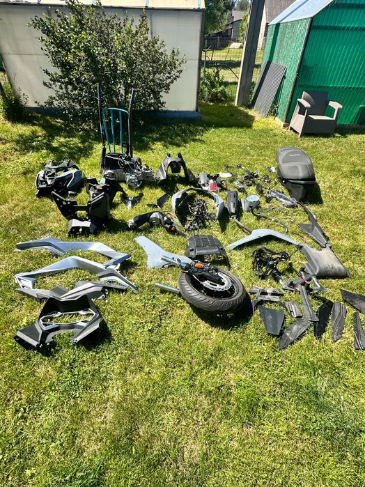 Części do  nowego Sym Cruisym 125 silnik lagi licznik koła owiewki