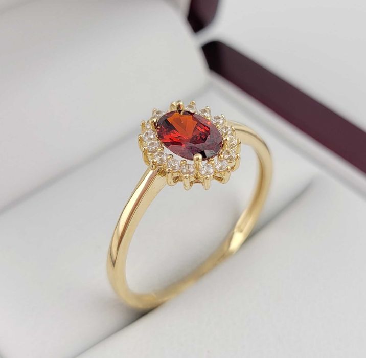 Złoty pierścionek z czerwonym kamieniem 2,09g PR.585 14K R.21