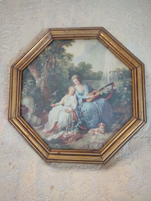 Frame with reproduction of an antique painting.