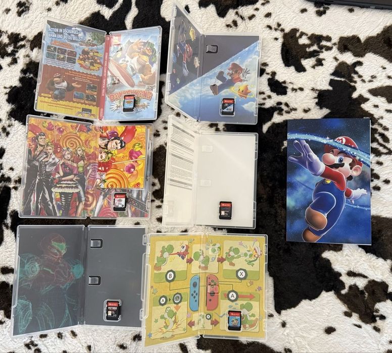 Nintendo Switch V2 incluindo 7 jogos + conta com vários jogos