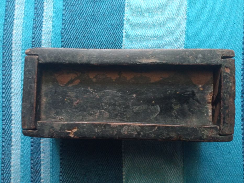 Dominó de osso e ebano e metal