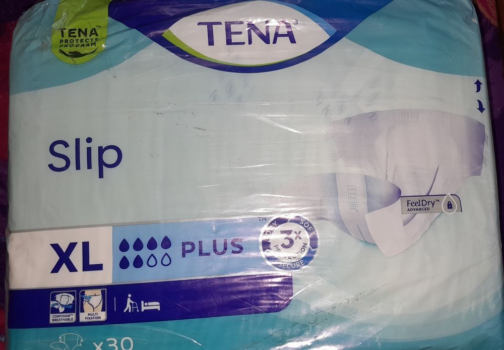 Памперси Tena Slim plus XL 20 штукдля дорослого XL
