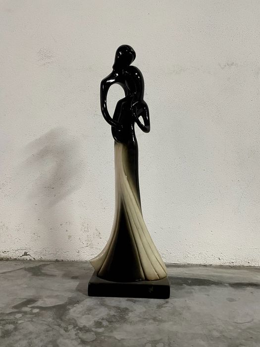 Estatueta casa-grávida