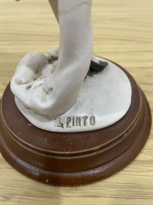 Estatueta de mulher