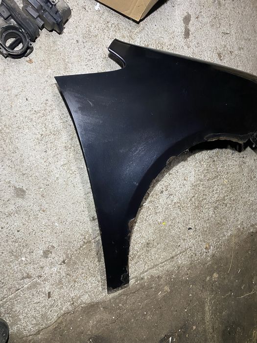 Błotnik przód prawy VW Touran lift 06-10r czarny
