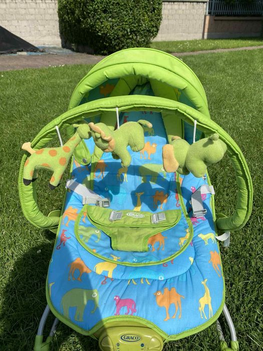 GRACO leżaczek zielony z muzyką w zwierzątka