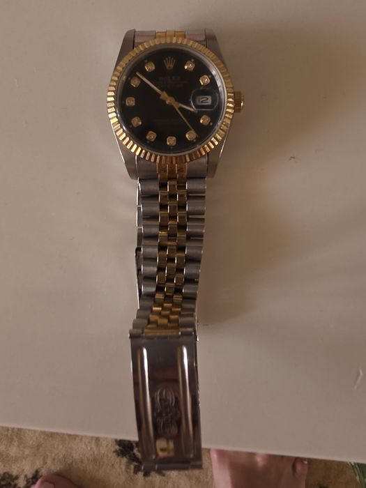 Часы Rolex в идеальном состоянии.