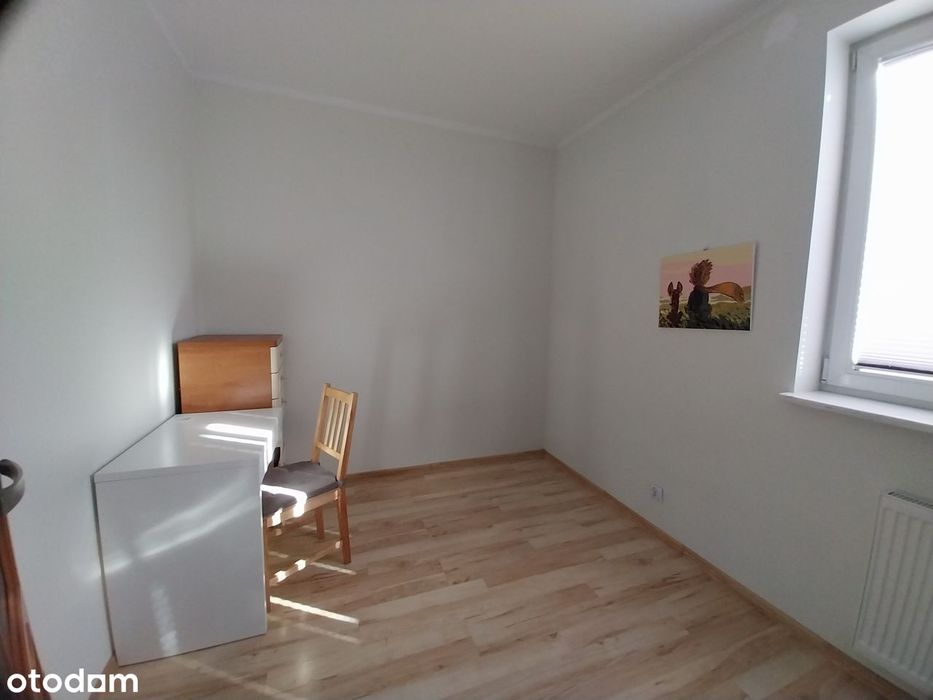 Dwupoziomowe mieszkanie z ogródkiem i garażem