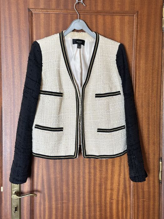 Casaco boucle bege e preto Mango
