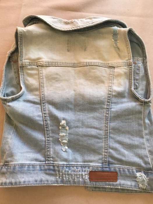 Colete ganga manchado