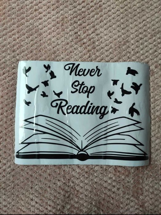 Naklejka na ścianę, okno lub lustro z książką never stop reading
