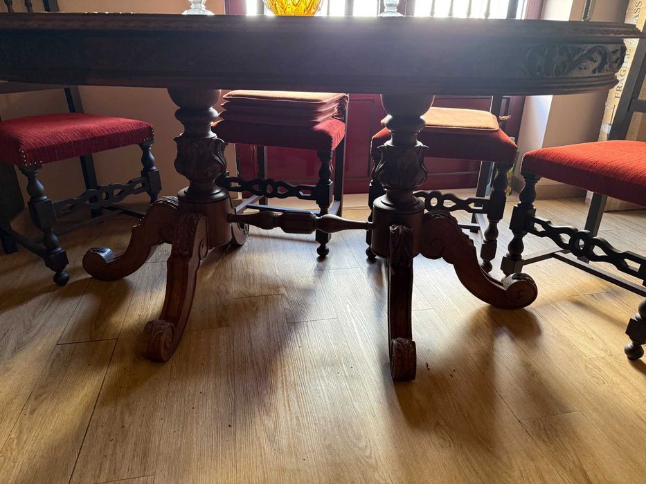 Ornate dining table with beautiful carvinings and 4 chairs