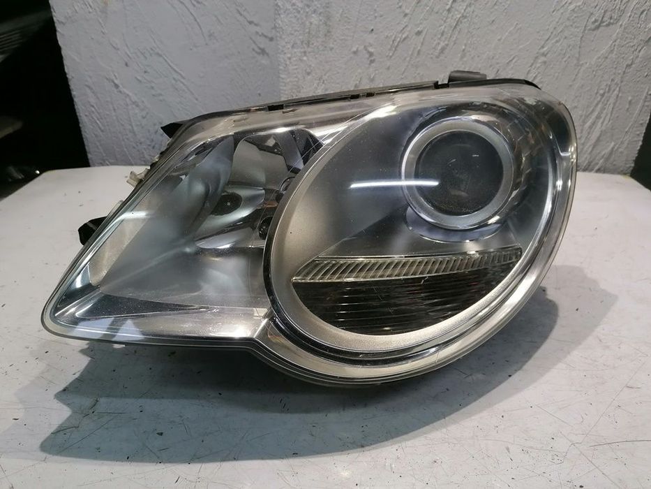 VW EOS 09r LAMPA LEWY PRZÓD PRZEDNIA 1Q1941005B EUROPA