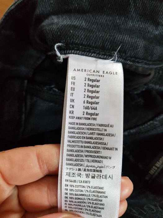 Czarne spodnie jeansowe z dziurami 34/36