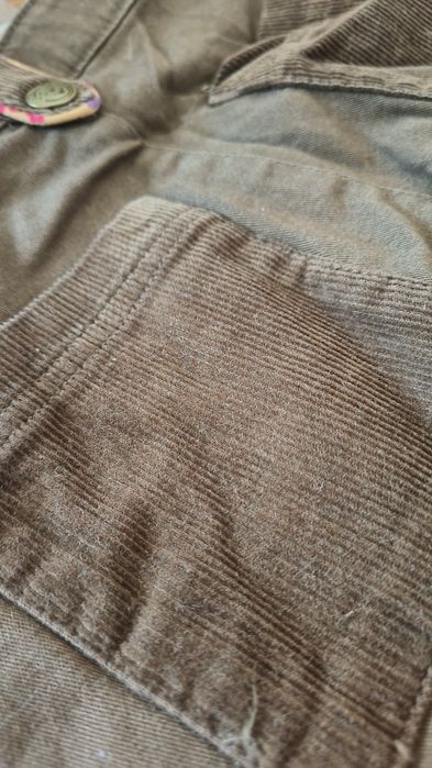 Brązowe jeansy z Kubusiem Puchatkiem