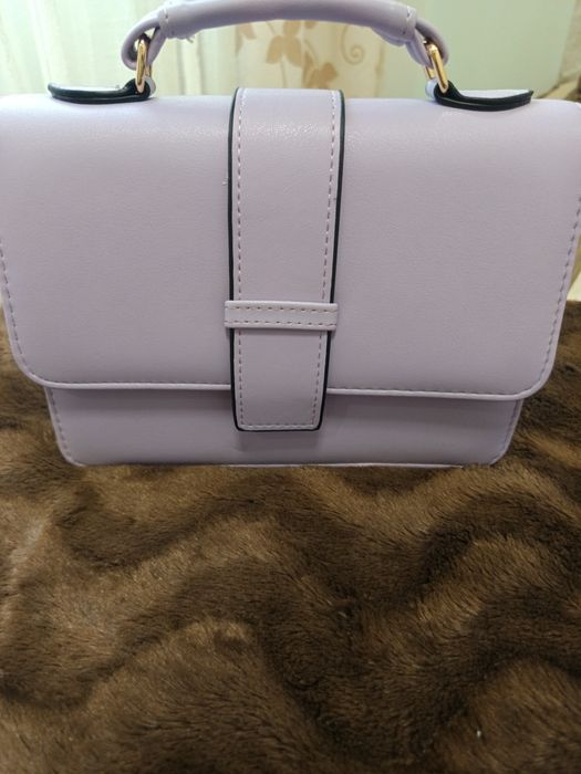 Mala de mão e a tiracolo e porta moedas