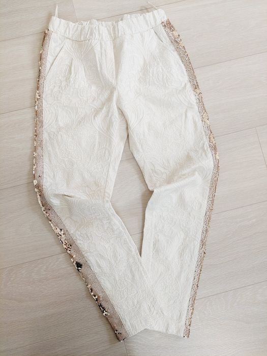 Eleganckie spodnie kremowe rizm 34-36 XS-S