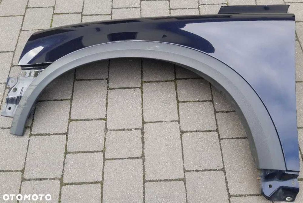 Volvo XC90 XC 90 błotnik lewy przód przedni z listwą granatowy