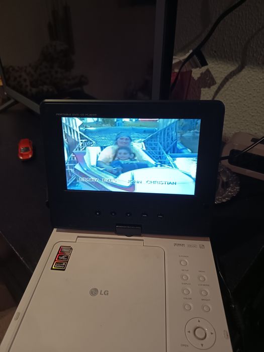DVD portátil para venda a funcionar com os acessórios e mala LG