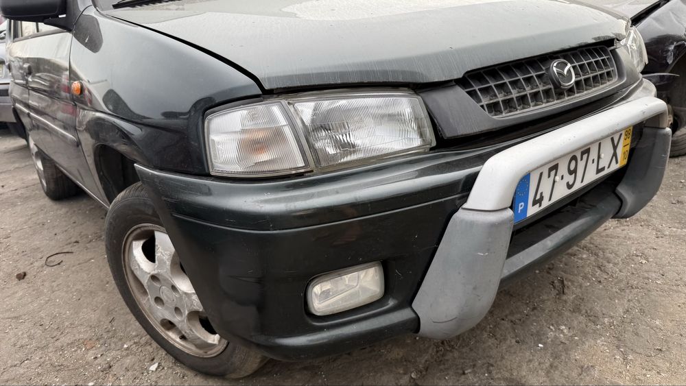 Faróis ótica e piscas  direita /esquerda Mazda demio  ano 1998