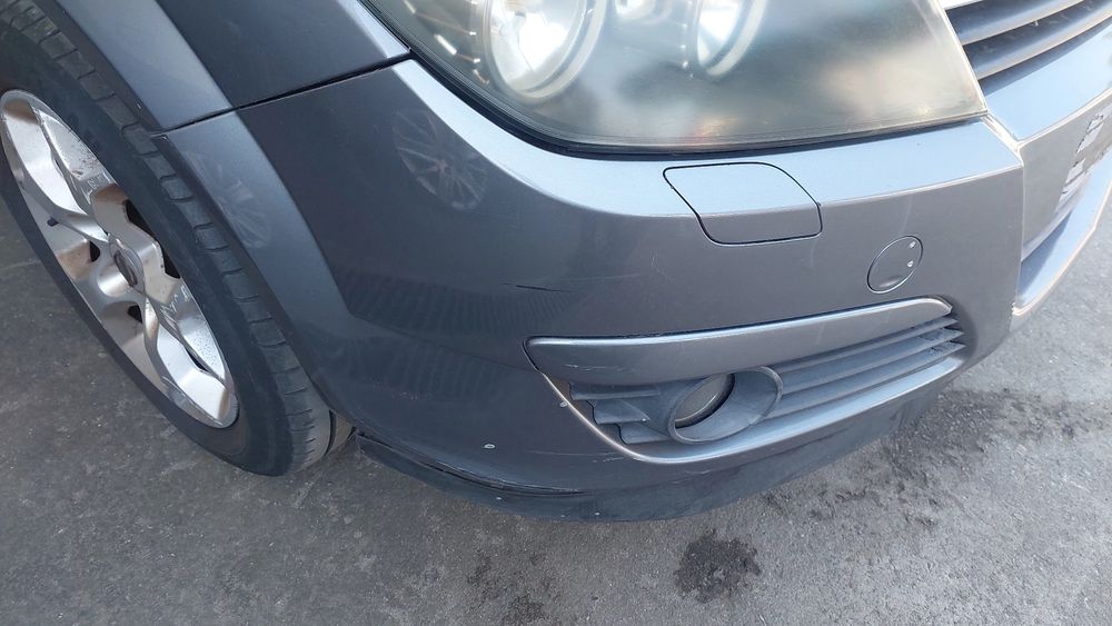 Pára-choques frente OPEL Astra H Caravan (L35)
