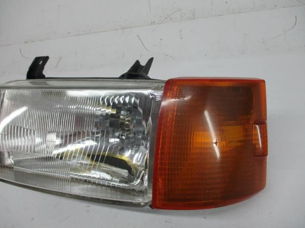Ótica / farol esquerda VOLKSWAGEN Transporter IV Chassis Cabina (70XD)