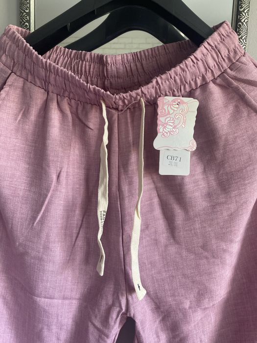 Materiałowe ,lekkie spodnie pudrowy róż moda włoska