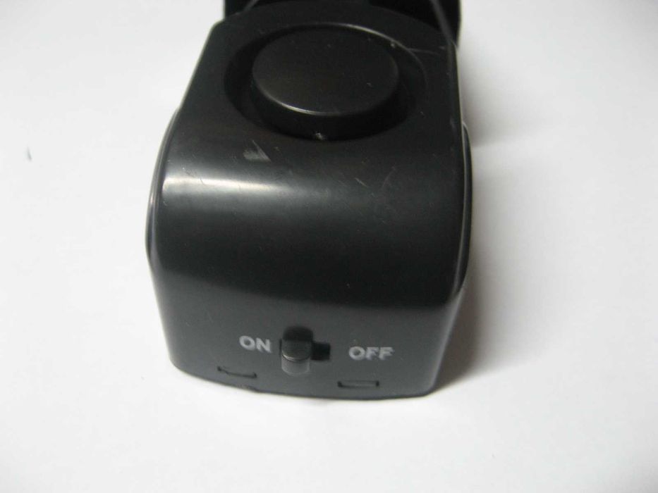 Travão de porta com alarme