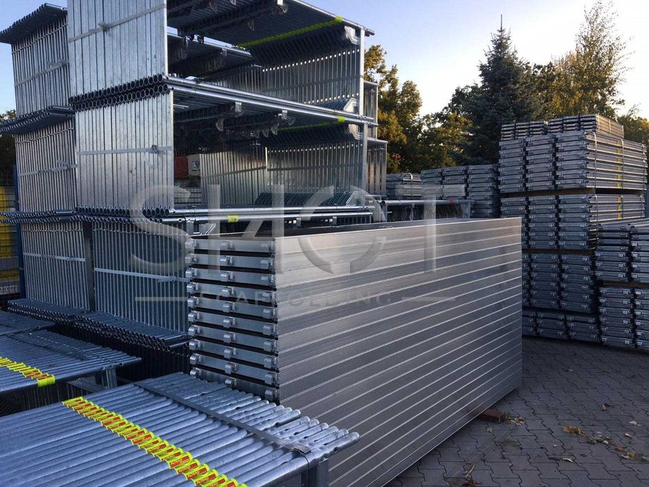 Nowe rusztowanie stalowe, typ Baumann z podestami roboczymi alu-sklejka 3,07 m 10,4 m x 9,21 m = 95 m 2