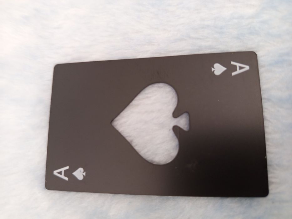 Abre cápsulas Às de paus.