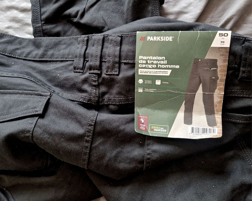 Calças de trabalho novas a estrear multibolsos em preto e cinza 
Elást
