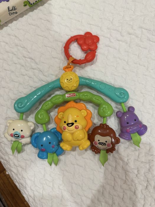 Брязкальце  Фишер прайс на візок ліжко