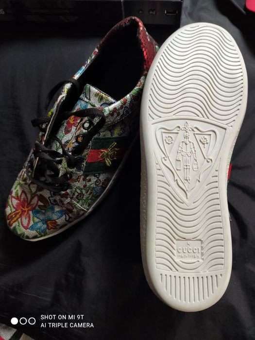 Кросівки Gucci Ace з квітковим принтом.