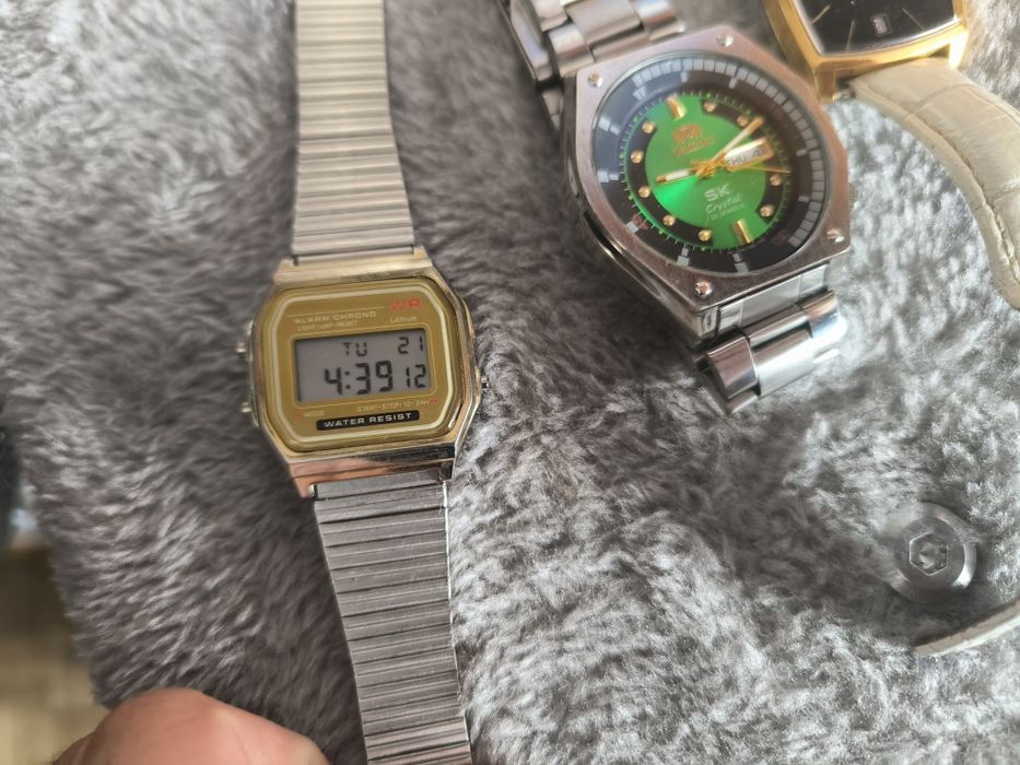 3 zegarki orient Armani i jakis elektroniczny