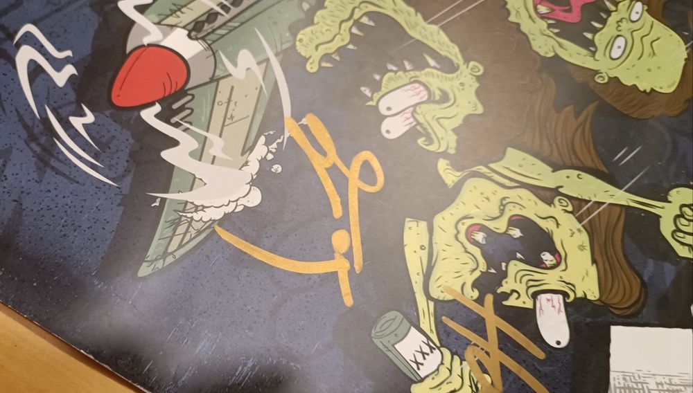 Plakat Airbourne z podpisami całego zespołu