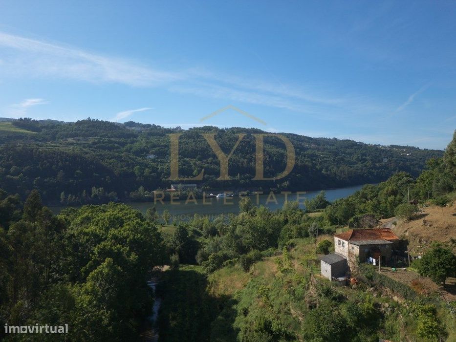 Estate with Two Stone Houses and River View