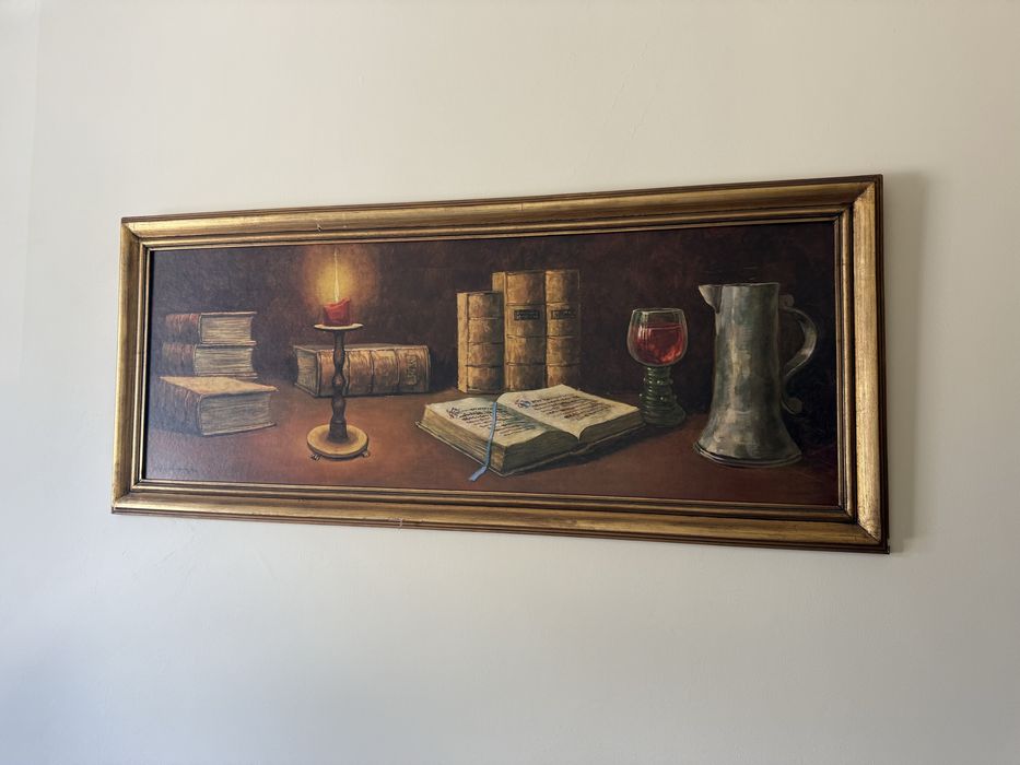 Quadro com pintura de livros e vela